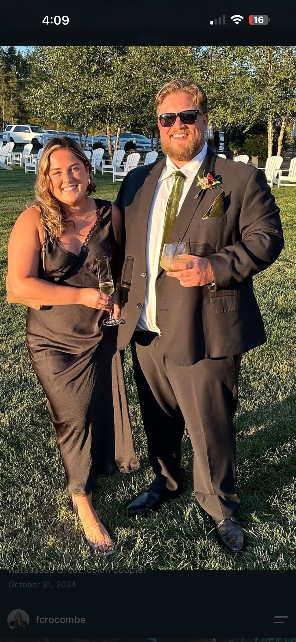 Eric Olsen with his partner at an outdoor celebration